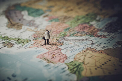 Miniature businessman on map of Europe - slon.pics - free stock photos and illustrations