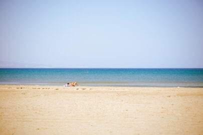 Undefined lady laying at the summer beach - slon.pics - free stock photos and illustrations