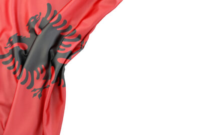 Flag of Albania in the corner on white background. Isolated, contains clipping path - slon.pics - free stock photos and illustrations