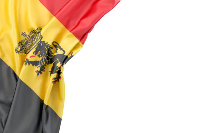 Flag of Belgium with coat of arms in the corner on white background. Isolated, contains clipping path - slon.pics - free stock photos and illustrations