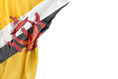 Flag of Brunei in the corner on white background. Isolated, contains clipping path - slon.pics - free stock photos and illustrations
