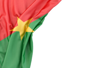 Flag of Burkina Faso in the corner on white background. Isolated, contains clipping path - slon.pics - free stock photos and illustrations