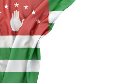 Flag of Abkhazia in the corner on white background. Isolated, contains clipping path - slon.pics - free stock photos and illustrations