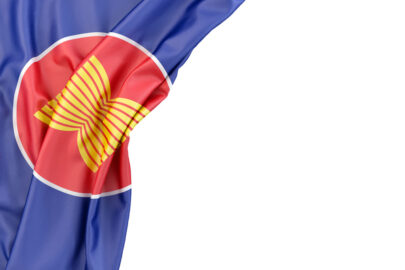 Flag of Association Of Southeast Asian Nations (ASEAN) in the corner on white background. Isolated, contains clipping path - slon.pics - free stock photos and illustrations