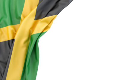 Flag of Jamaica in the corner on white background. Isolated, contains clipping path - slon.pics - free stock photos and illustrations