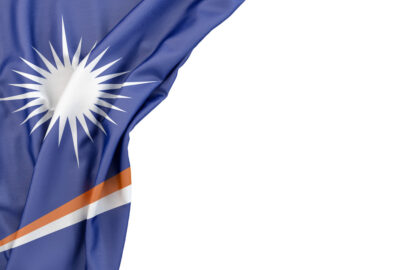 Flag of Marshall Islands in the corner on white background. Isolated, contains clipping path - slon.pics - free stock photos and illustrations