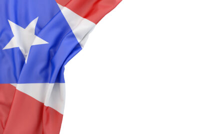 Flag of Puerto Rico in the corner on white background. Isolated, contains clipping path - slon.pics - free stock photos and illustrations