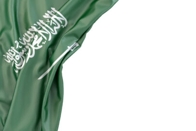 Flag of Saudi Arabia in the corner on white background. Isolated, contains clipping path - slon.pics - free stock photos and illustrations