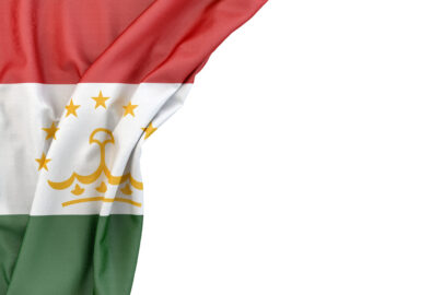 Flag of Tajikistan in the corner on white background. Isolated, contains clipping path - slon.pics - free stock photos and illustrations