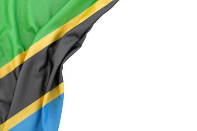 Flag of Tanzania in the corner on white background. Isolated, contains clipping path - slon.pics - free stock photos and illustrations