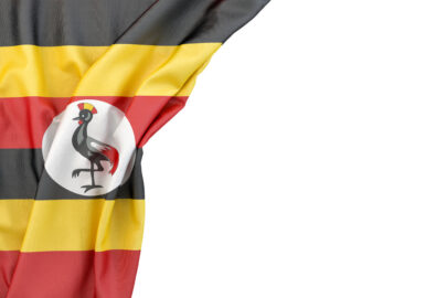 Flag of Uganda in the corner on white background. Isolated, contains clipping path - slon.pics - free stock photos and illustrations