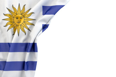 Flag of Uruguay in the corner on white background. Isolated, contains clipping path - slon.pics - free stock photos and illustrations