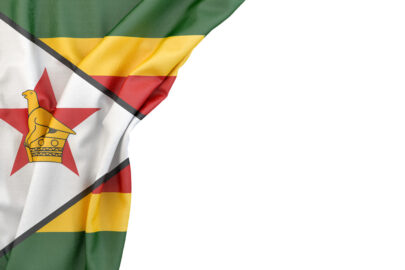 Flag of Zimbabwe in the corner on white background. Isolated, contains clipping path - slon.pics - free stock photos and illustrations