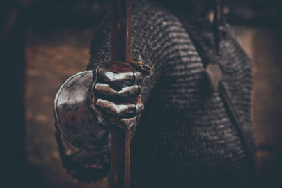 Knight’s hand in metal gloves holding spear - slon.pics - free stock photos and illustrations