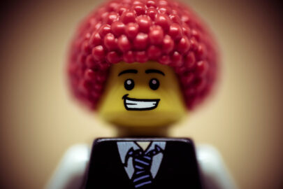 Portrait of a happy smiling businessman with clown wig - slon.pics - free stock photos and illustrations