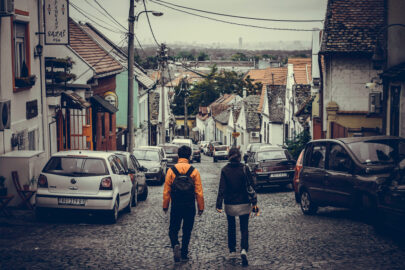 Traveling couple walking through old town of Zemun. Republic of Serbia - slon.pics - free stock photos and illustrations