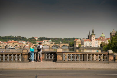 Undefined travelers with backpacks taking photos of Prague at Legion Bridge (Most Legii). Czech Republic - slon.pics - free stock photos and illustrations