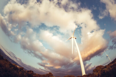 Wind turbine against cloudy sky - slon.pics - free stock photos and illustrations