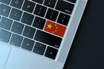 Chinese flag over computer keyboard - slon.pics - free stock photos and illustrations