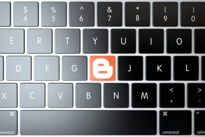 Blogger icon on laptop keyboard. Technology concept - slon.pics - free stock photos and illustrations