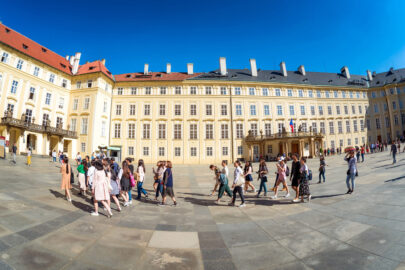 Group of tourists in the third courtyard of Prague Castle. Prague, Czech Republic, May 18, 2017 - slon.pics - free stock photos and illustrations