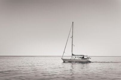Lonely sailboat in a calm sea - slon.pics - free stock photos and illustrations
