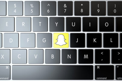 Snapchat icon on laptop keyboard. Technology concept - slon.pics - free stock photos and illustrations