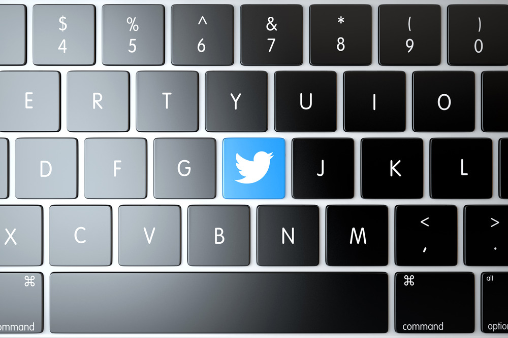 Twitter icon on laptop keyboard. Technology concept
