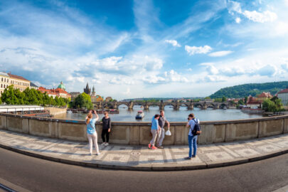 Undefinable tourists taking pictures at Manes Bridge (Manesuv most). Prague, Czech Republic - slon.pics - free stock photos and illustrations