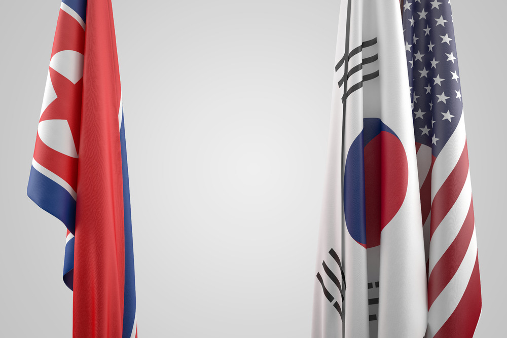 Flags of USA, South and North Korea. Political confrontation concept