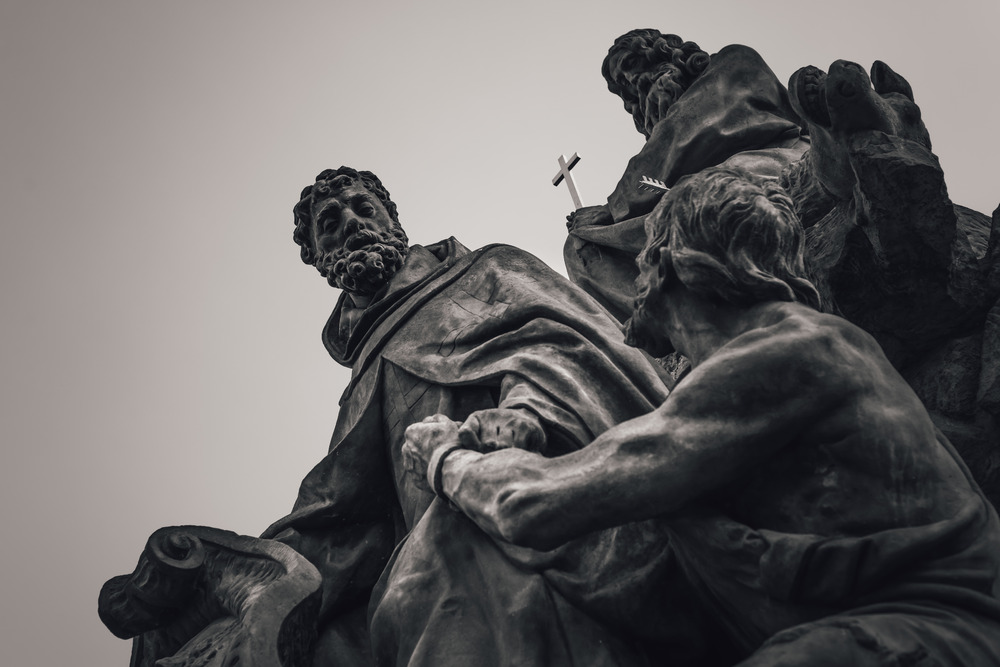 Statue of Saints John of Matha, Feliz of Valois, and Ivan on Charles Bridge. Prague, Czech Republic