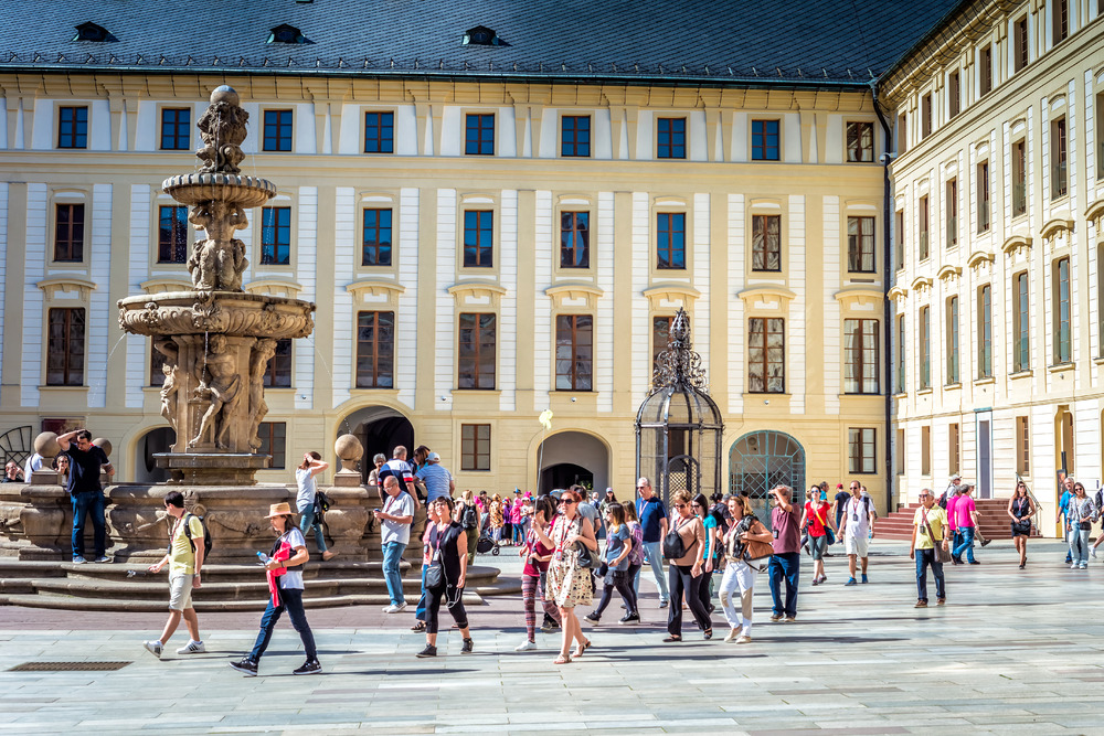 Group of people with a tour guide at the Prague Castle. Prague, Czech Republic. May 18, 2017
