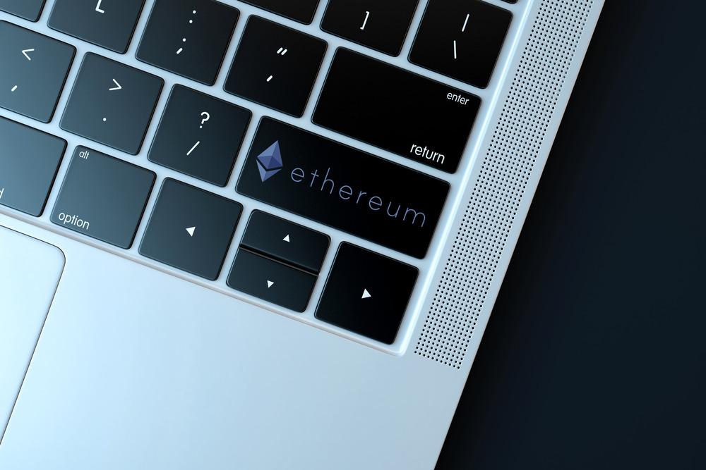 Ethereum icon on laptop keyboard. Technology concept