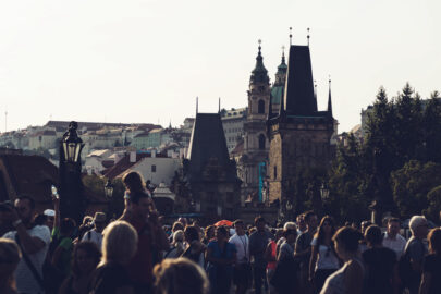 People walking across Charles Bridge. Prague, Czech Republic - slon.pics - free stock photos and illustrations