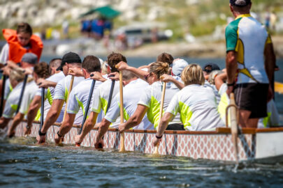 A team of dragon boat racers paddling their boat - slon.pics - free stock photos and illustrations