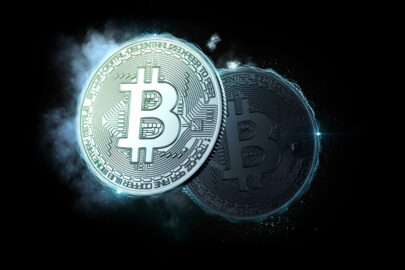 Bitcoin coins glowing in the dark - slon.pics - free stock photos and illustrations