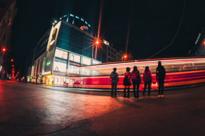 People on street amidst light trails at night - slon.pics - free stock photos and illustrations