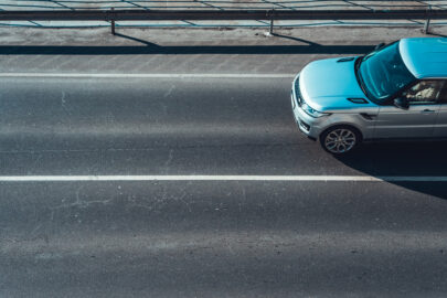 Car moving on empty road lane - slon.pics - free stock photos and illustrations
