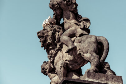 Statue of lion wearing a golden crown. Prague castle - slon.pics - free stock photos and illustrations