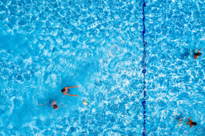 Swimming pool with playing people, overhead view - slon.pics - free stock photos and illustrations