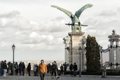 Tourists walk at Buda Castle near the Turul bird. Budapest - slon.pics - free stock photos and illustrations